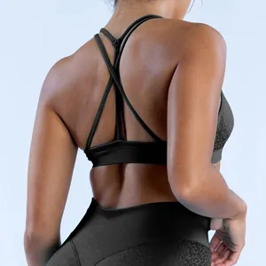 Detailed view of black seamless sports bra featuring intricate criss-cross back straps