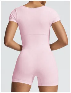 Detailed back view of a pink seamless ribbed short-sleeve yoga bodysuit for women fitness