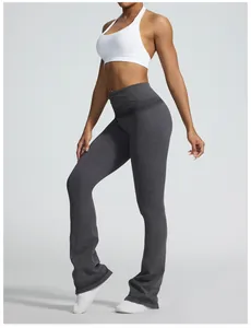 Detail of seamless yoga flared pants with foldover high waist and sand washed finish.