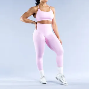 Detailed shot of seamless pink yoga sports bra and matching high-waisted leggings