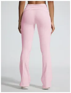 Close-up back view of pink seamless flared yoga pants with stylish fold-over waistband.