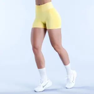 High-waisted yellow seamless fitness shorts for gym and yoga performance