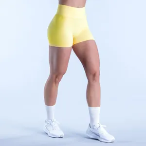 Detailed view of yellow high waist seamless fitness shorts for yoga and running