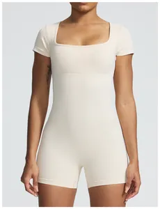 Close-up of cream seamless ribbed yoga bodysuit with square neck and short sleeves