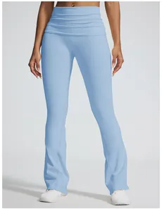 Detail of high-waist fold-over waistband on light blue seamless flared yoga pants