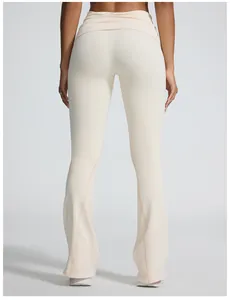 Back view of beige seamless flare yoga pants with fold-over waist and ribbed texture