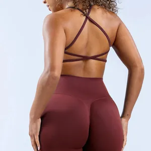 Close-up back view of maroon cross-back sports bra and high-waisted seamless leggings set