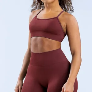 Macro view of the athletic fit and matte finish of this burgundy seamless yoga sports bra