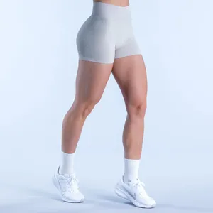 Side view of light grey seamless high-waist fitness shorts on a fitness model