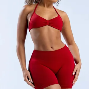 Detailed view of a red seamless yoga halter bra and matching high-waisted shorts set