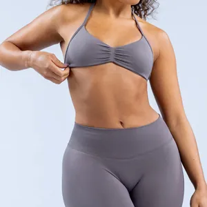 Close-up detail of seamless matte nylon yoga halter bra and high-waist leggings