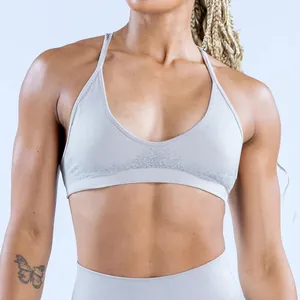 Close-up of seamless light gray sports bra featuring textured jacquard under-bust band