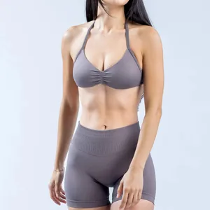 High-performance seamless halter neck yoga bra and shorts set in a matte mauve finish