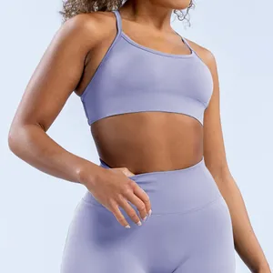 Detailed view of lavender seamless matte nylon sports bra with cross back design.