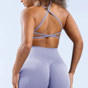 Detail of light purple yoga set with cross back bra and high-waisted seamless leggings