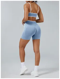 Back view of a blue and white color-block yoga set showing slim fit and high-waist biker shorts