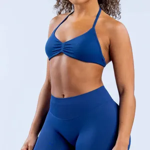 Detail shot of high-stretch blue seamless yoga halter bra and matching leggings