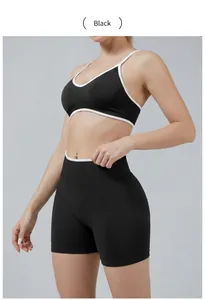 Close-up of black color-blocked sports bra and high-waisted yoga shorts set