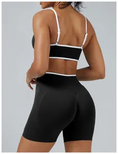 Back view detail of two-piece black and white color block yoga set for fitness