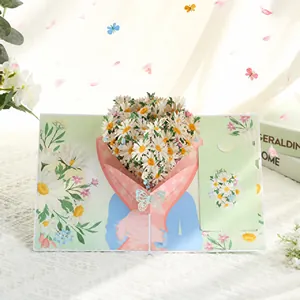 Détail de la carte de vœux 3D pop-up avec un design de bouquet de marguerites vibrant.