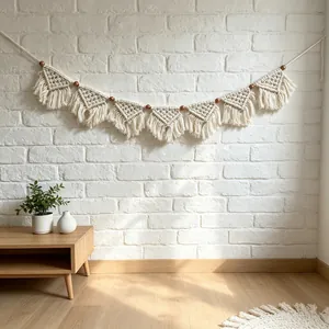 Handmade bohemian macrame wall hanging banner with cotton fringe on white brick wall