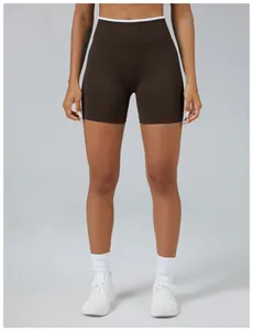 Front view of dark brown seamless yoga shorts with high white waistband detail and ribbed texture