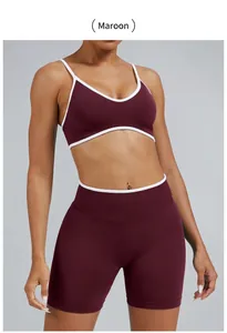 Detailed view of women's chestnut yoga two-piece set featuring white contrast piping trim