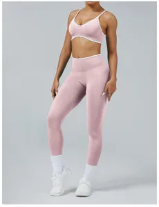 Pink seamless yoga set with high waist leggings and contrast trim sports bra