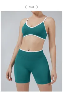 Close-up of cyan yoga set featuring a colorblock sports bra and high-waist shorts for fitness
