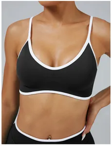 Detailed close-up of a black and white contrast sports bra with a ribbed underbust band
