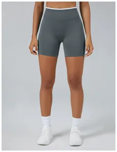 Detail front view of grey seamless high-waisted yoga shorts with peach butt lifting design