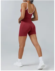 Back view of a red two-piece yoga set featuring contrast white trim and tight-fit shorts