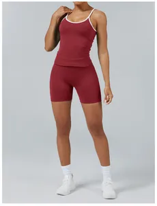 Detailed look at the burgundy two-piece yoga fitness set with white piping detail
