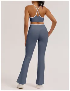 Back view of premium high-waisted flare yoga pants in dusty blue with micro-flare leg