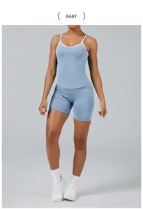 Detail view of two-piece baby blue yoga set with color-block camisole and shorts