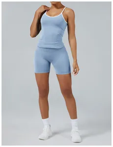 Two-piece light blue yoga set with contrast white trim on camisole and shorts outfit.