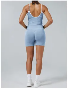 Detailed back view of a blue and white contrast yoga set with a backless top and tight shorts