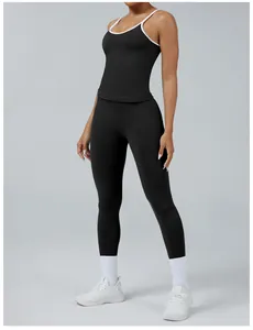 Detailed full-body view of women's black yoga set showing contrast trim and slim fit