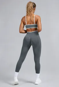 Back view of premium graphite grey seamless yoga set with white contrast trim details