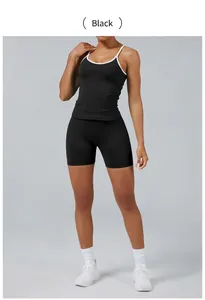 Two-piece black yoga set with white contrast piping featuring camisole and tight shorts