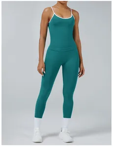 Full view of teal yoga tank top with white piping and matching high-waist leggings set.