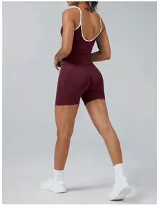 Detailed back view of burgundy yoga set featuring white contrast trim and tight fit