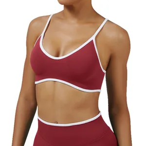 Burgundy sports bra with white contrast straps for yoga and gym fitness training