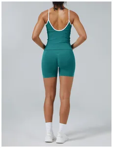 Back view of women's teal and white color-block yoga set showing slim fit and backless style