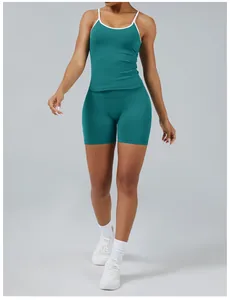 Full view of women's teal two-piece yoga set with white contrast piping detail.
