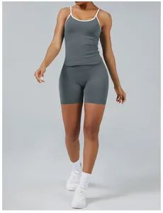Full body view of a women's grey and white contrast athletic yoga set on a model