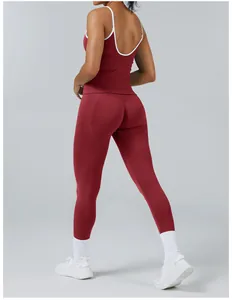 Professional back view of burgundy yoga set featuring white trim and high waist leggings