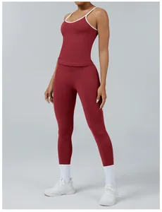 Detail view of burgundy colorblock yoga set featuring contrast piping tank and leggings