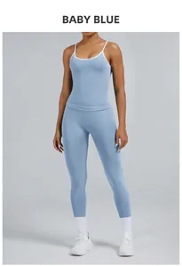 Detailed view of women's baby blue two-piece yoga set with contrasting white trim