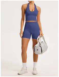 Professional detail of women's blue seamless ribbed yoga set with halter sports bra